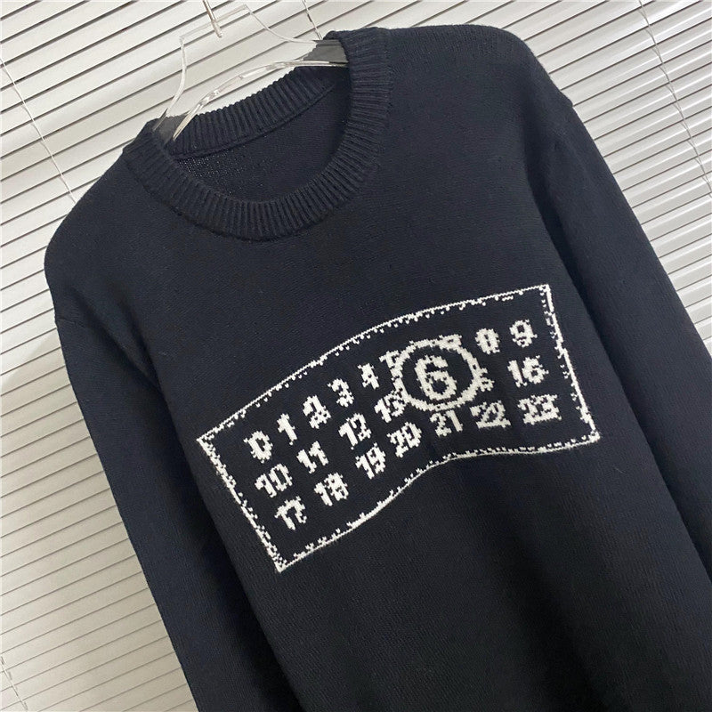 Navy knit sweater with ribbed crew neck and white rectangular number graphic on chest