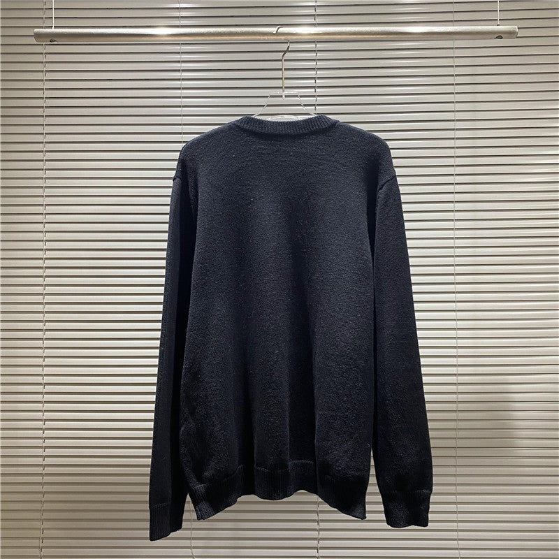 Navy knit sweater on hanger with ribbed crew neck, long sleeves, and relaxed fit