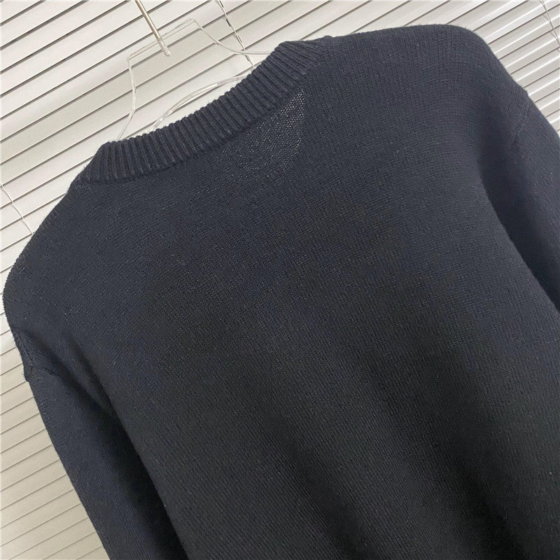 Navy knit sweater back view with ribbed collar and textured knit fabric