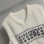 Cream knit vest V-neck with embroidered number graphic patch on chest
