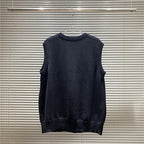 Dark sleeveless V-neck knit top with ribbed neckline and straight hem