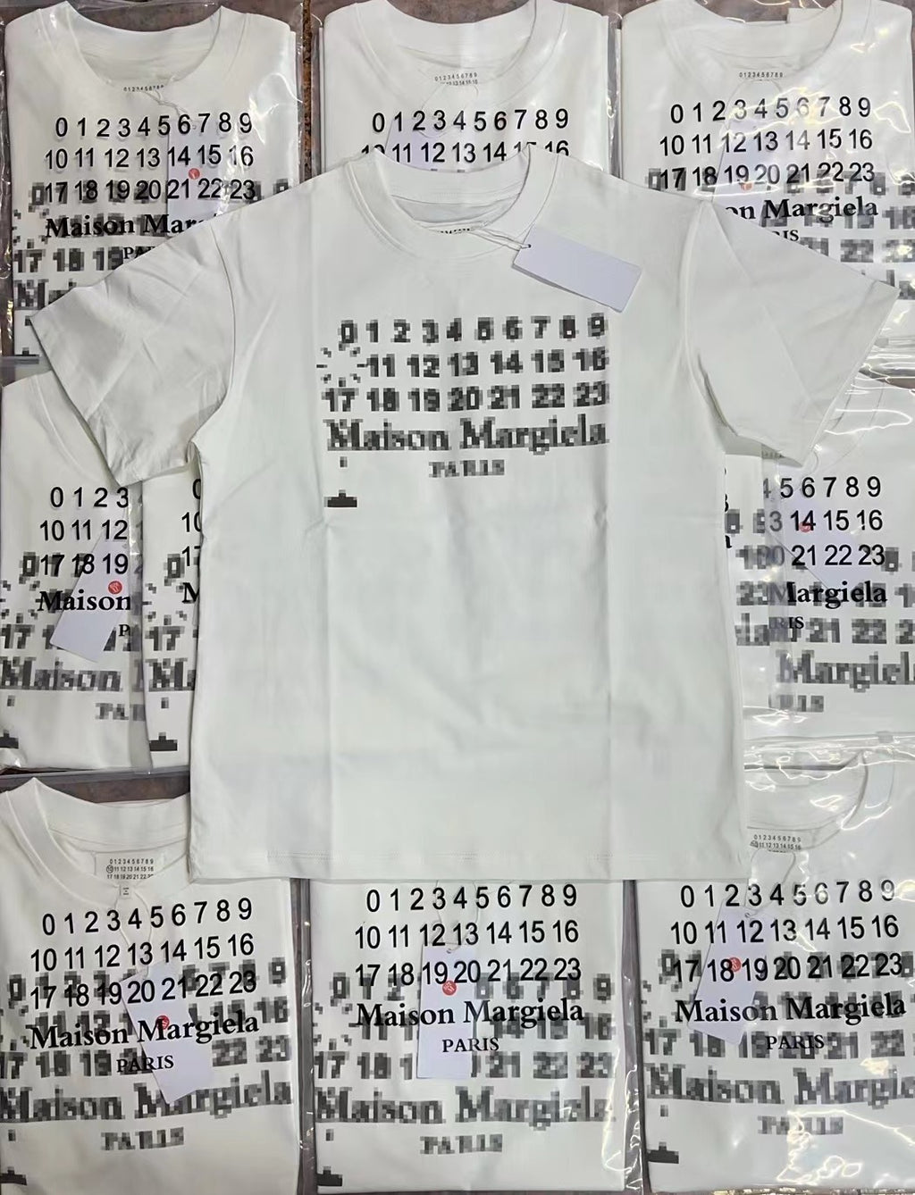White graphic T-shirt showing front and back views with Maison Margiela number print