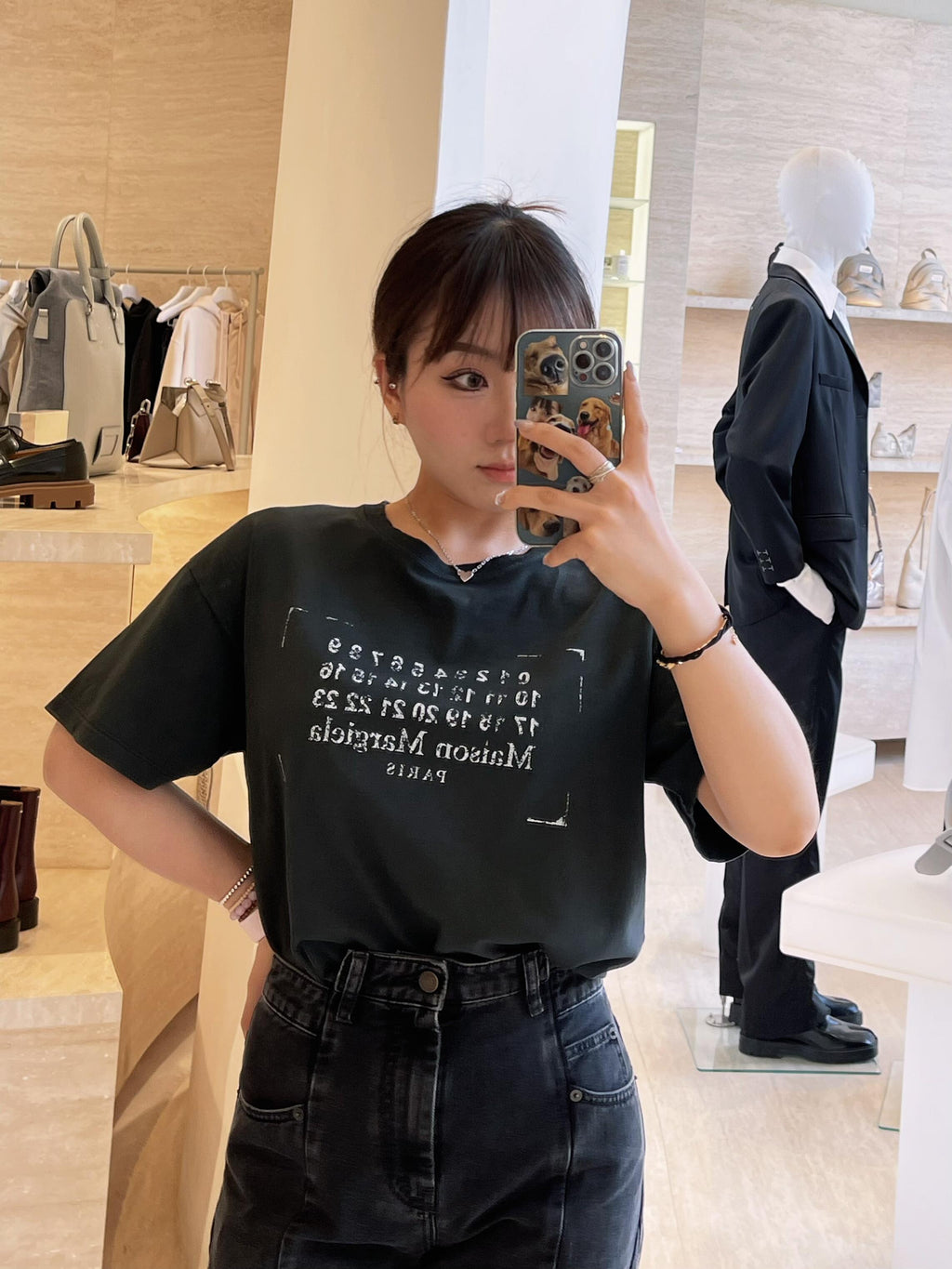 Black T-shirt on model with graphic numbers and “PARIS” chest print