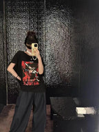 Maison Margiela black graphic T-shirt with short sleeves, front print visible