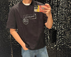 Black crew-neck T-shirt with Maison Margiela logo patch and 52 label