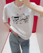 Maison Margiela white T-shirt with animal graphic print worn by a person