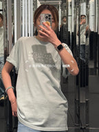 Maison Margiela light crew-neck T-shirt with small chest graphic on model
