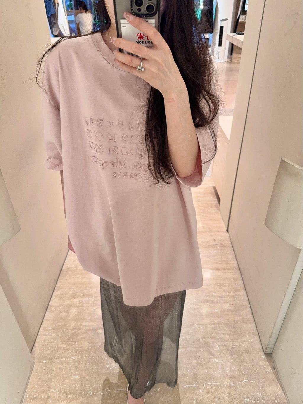 Blush pink oversized T-shirt with crew neck and logo text print