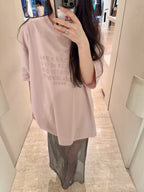 Blush pink oversized T-shirt with crew neck and logo text print