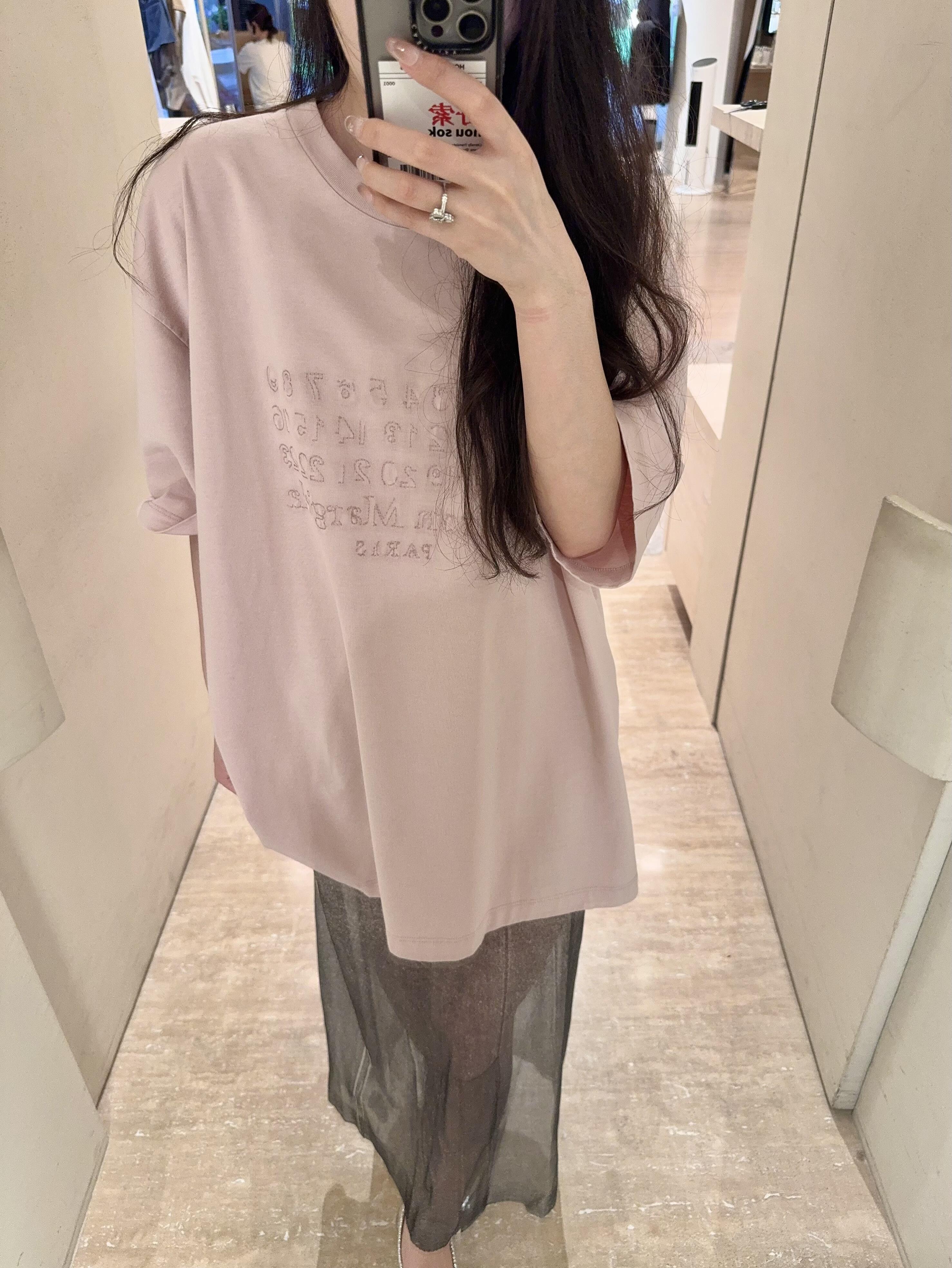 Blush pink oversized T-shirt with crew neck and logo text print