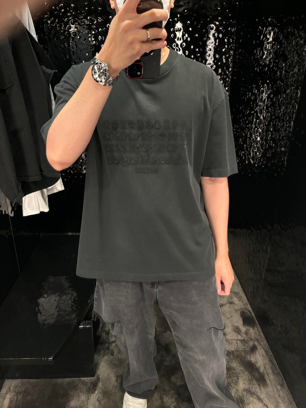 Charcoal gray oversized T-shirt with crew neck and faint logo print