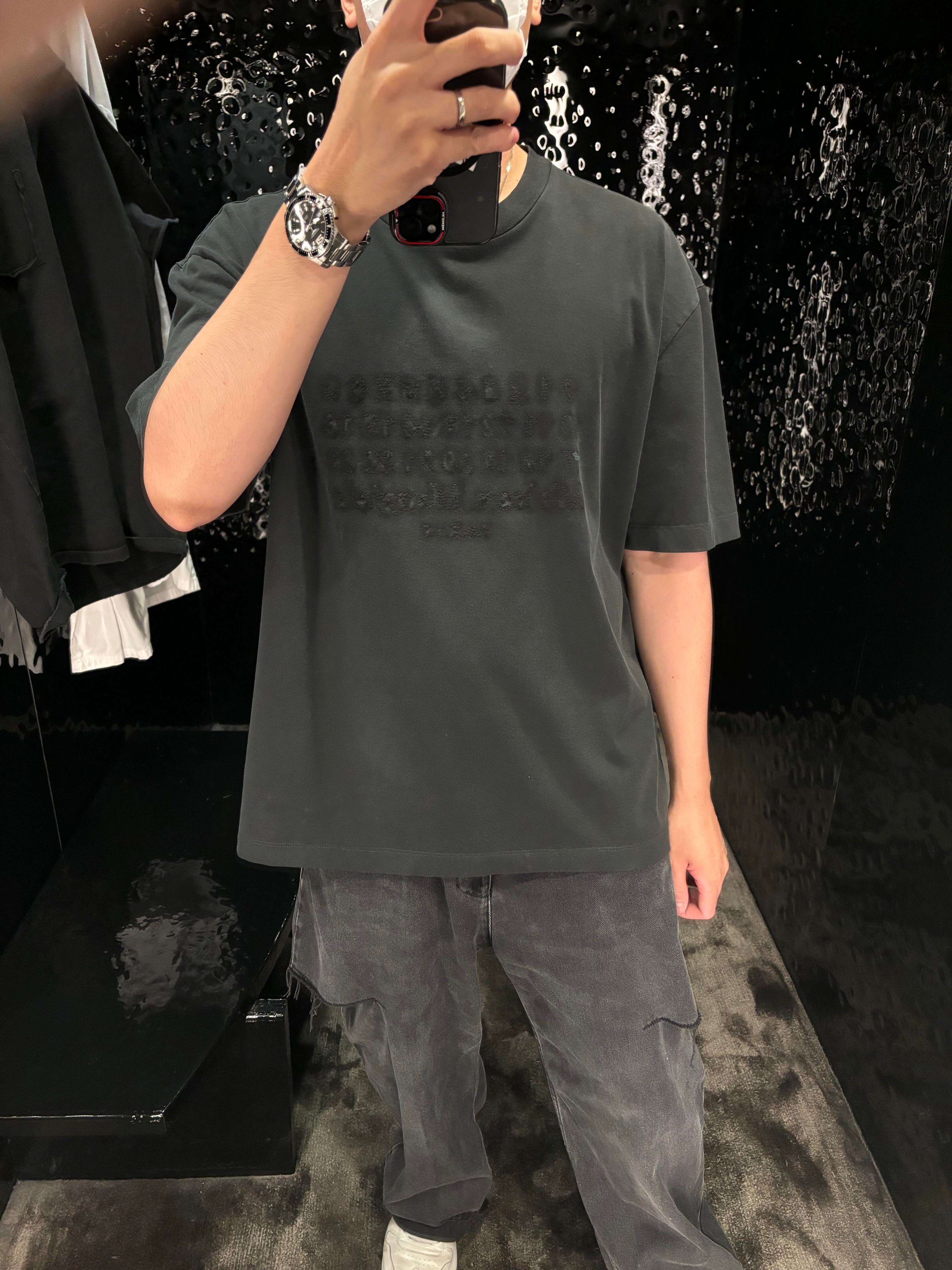 Charcoal gray oversized T-shirt with crew neck and faint logo print