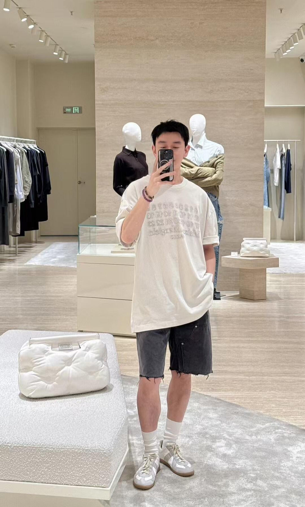 White short-sleeve T-shirt with crew neck and subtle logo print