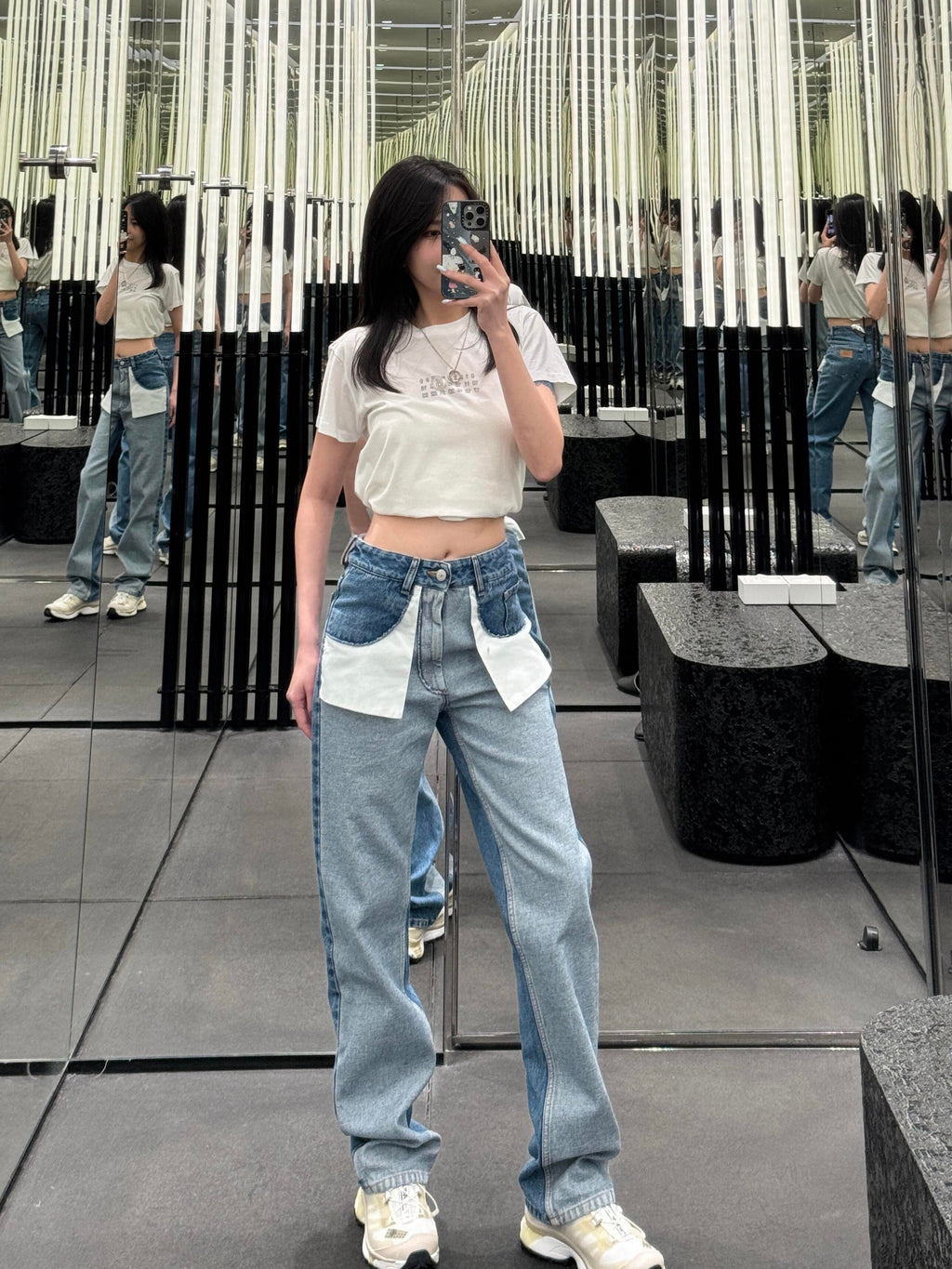 White crop T-shirt worn with light blue jeans