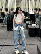 White crop T-shirt worn with light blue jeans