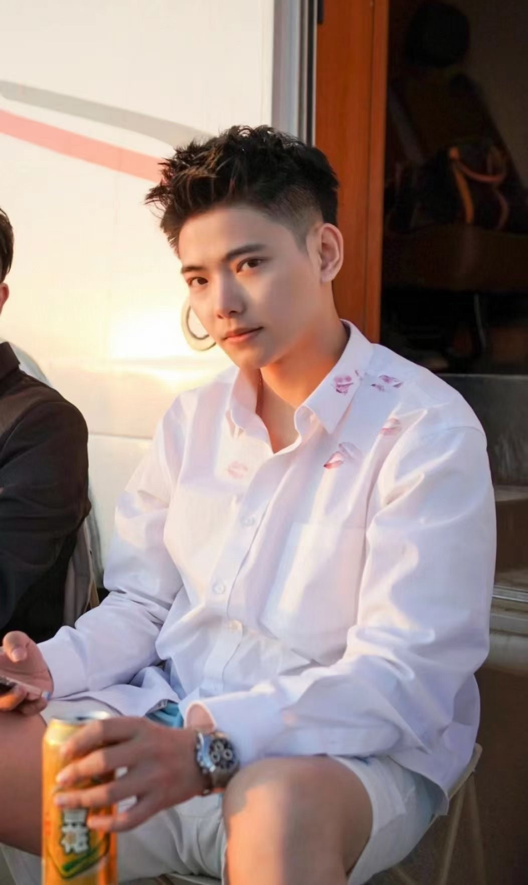 White button-up shirt with red lip print worn by model