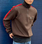 Brown quarter-zip knit pullover with red shoulder stripe and chest zip