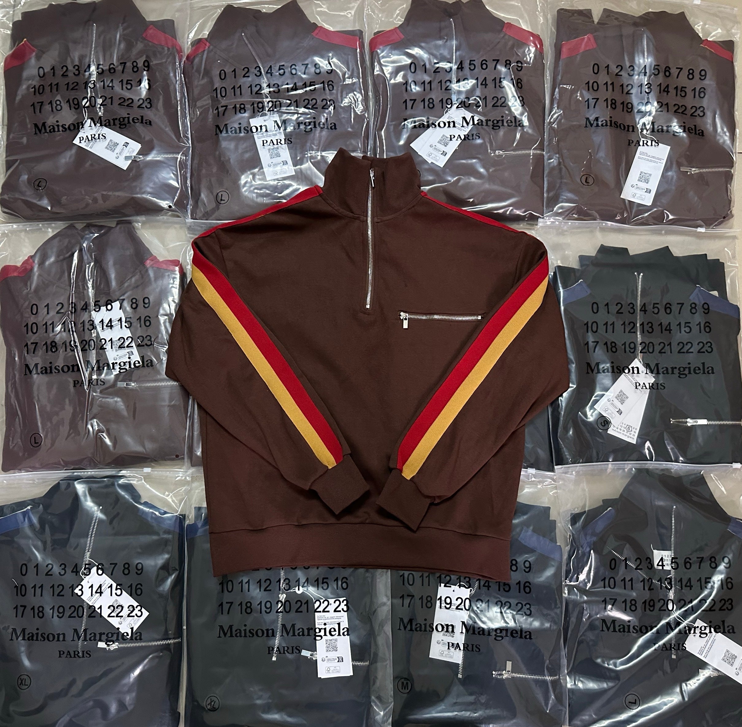 Brown long-sleeve quarter-zip pullover with red and yellow stripe paneling