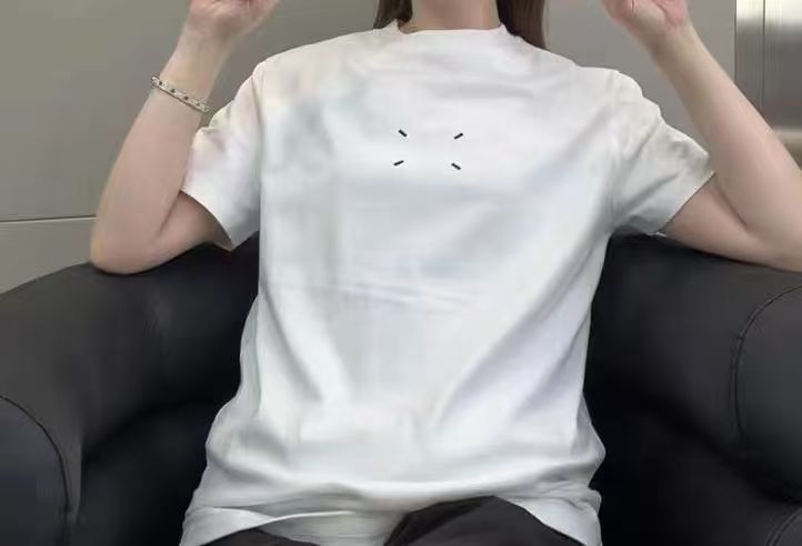 White crewneck T-shirt with small dash graphic on the upper back