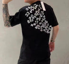 Black graphic T-shirt with circular number print and short sleeves