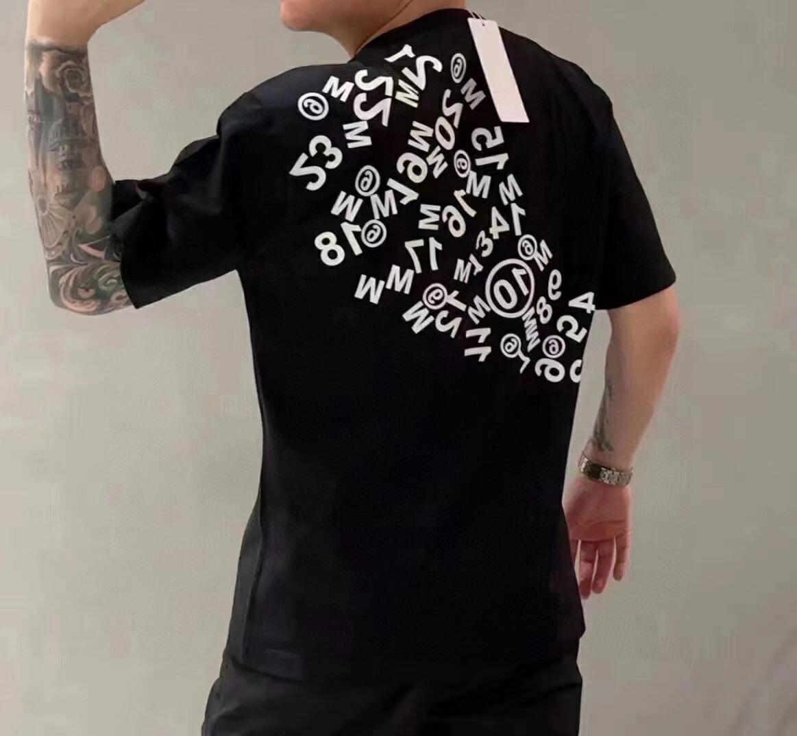 Black graphic T-shirt with circular number print and short sleeves