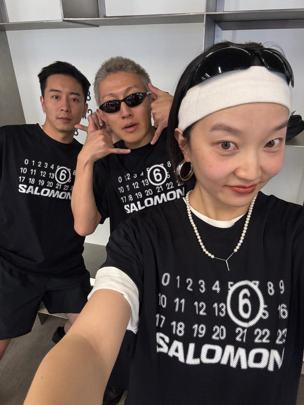 Black T-shirt with SALOMON number 6 graphic, worn by model