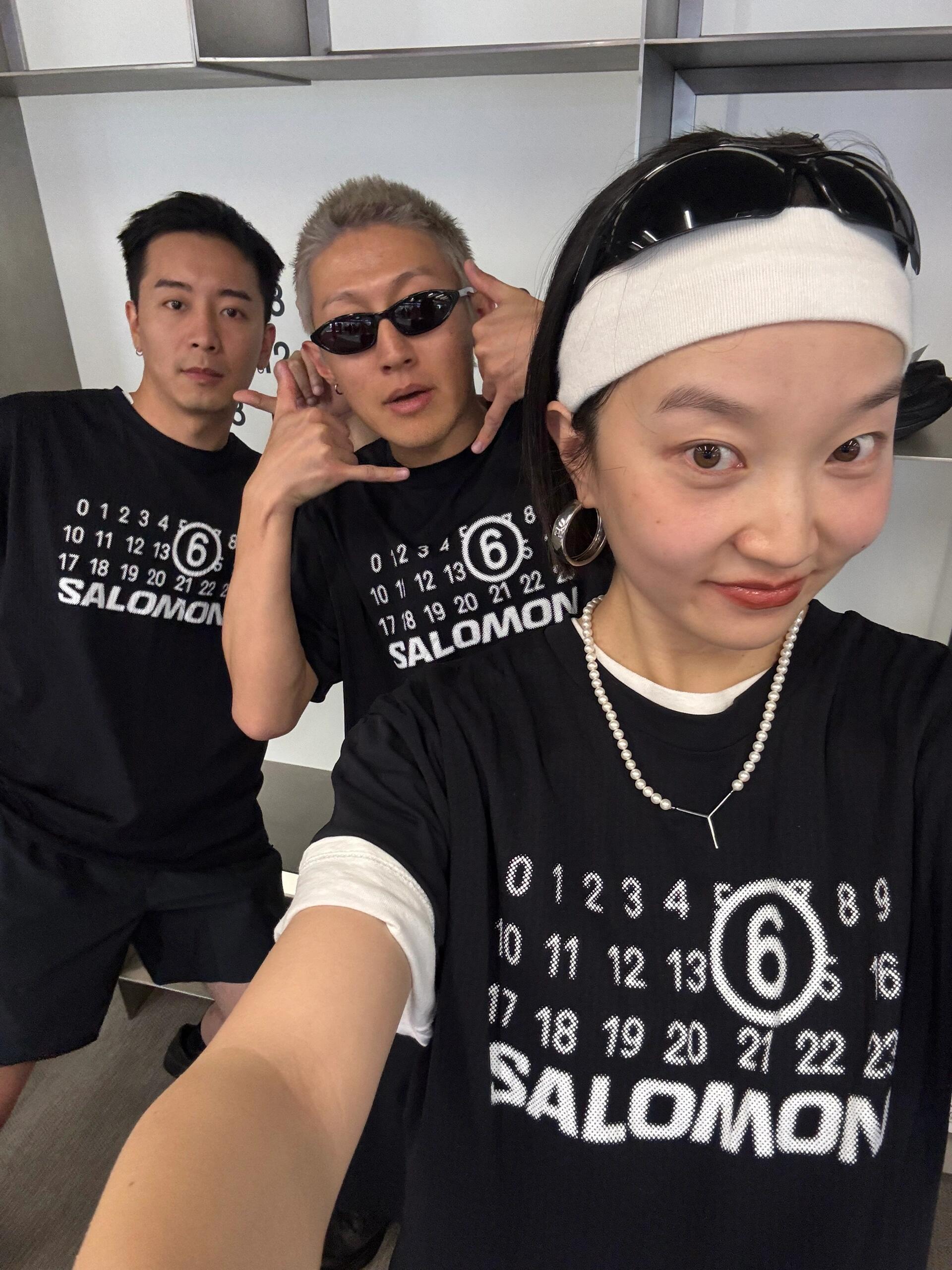 Black T-shirt with SALOMON number 6 graphic, worn by model