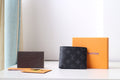 Louis Vuitton small bag, black monogram leather pouch with flap closure