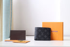 Louis Vuitton small bag, black monogram leather pouch with flap closure