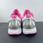 Pink heel and rear view of low-top sneakers with white midsole and pull tab