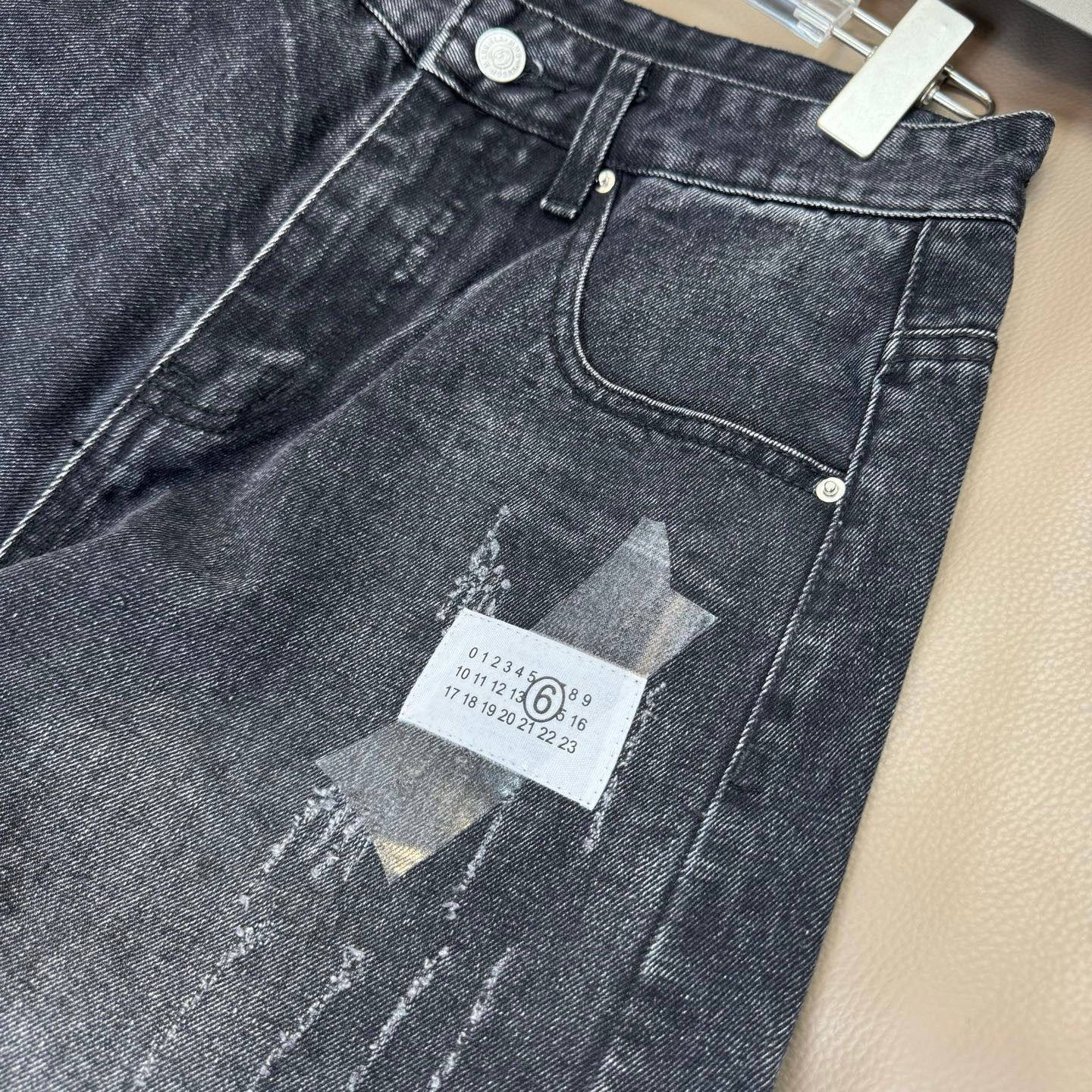 Maison Margiela denim jeans front waistband with button closure and pocket stitching
