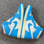 Air Jordan 1 Retro High OG sneakers pair, blue and white high-top with cream sole
