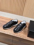 Black lace-up sneakers with white sole and contrasting laces, Chanel