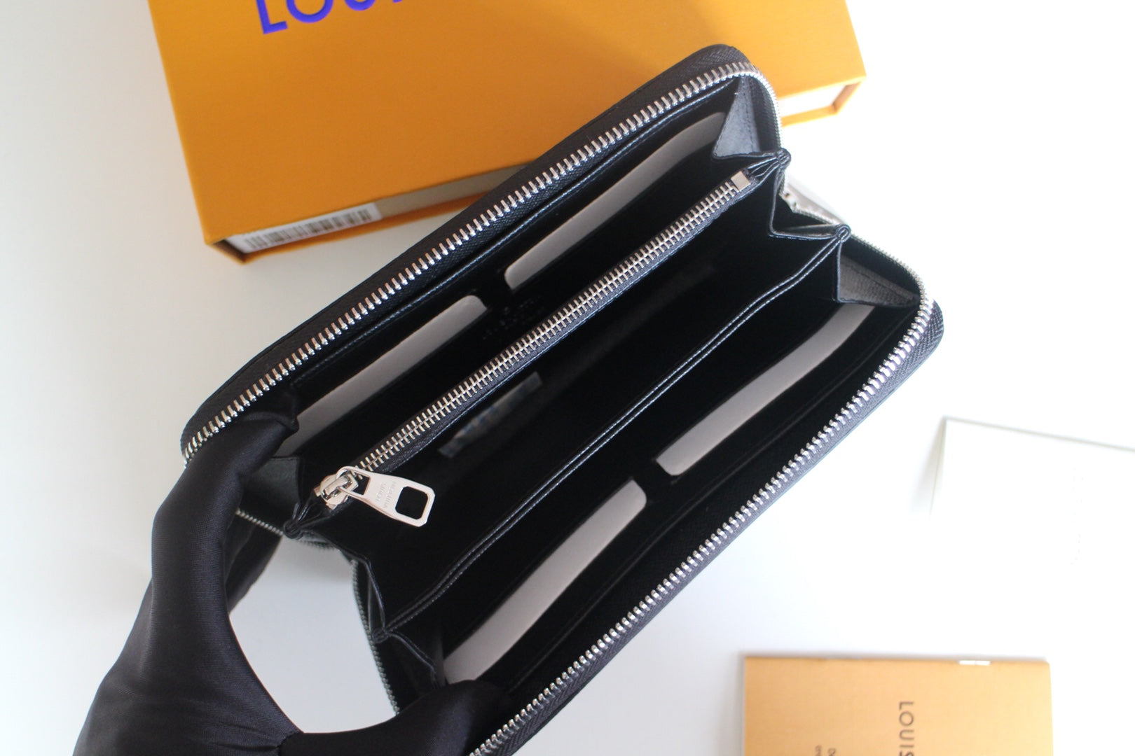 Louis Vuitton small zip bag interior with card slots and a zippered compartment
