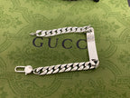 Silver chain bracelet with white leather Gucci logo panel and two lobster clasps