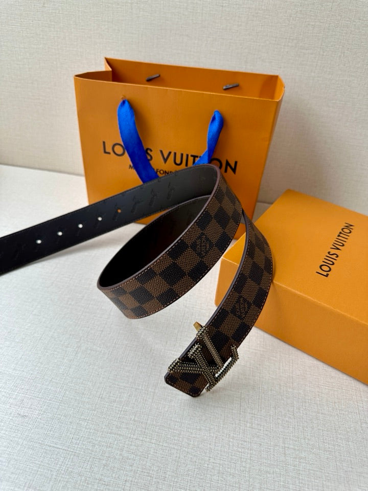 Louis Vuitton belt with checkered strap and silver-toned V buckle