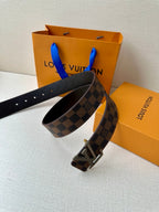 Louis Vuitton belt with checkered strap and silver-toned V buckle