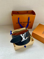 Louis Vuitton belt in dark blue leather with silver LV buckle, resting on a box
