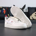 White Air Force 1 sneakers showing white rubber outsole tread and sidewall