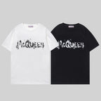 Black and white crewneck T-shirts with McQUEEN graffiti-style lettering