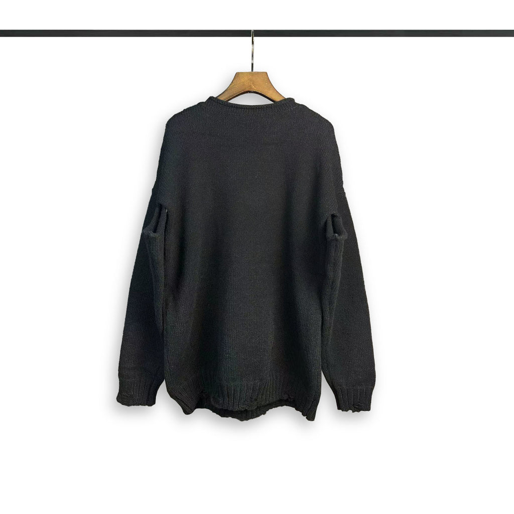 Dark crewneck sweatshirt with long sleeves and ribbed cuffs and hem