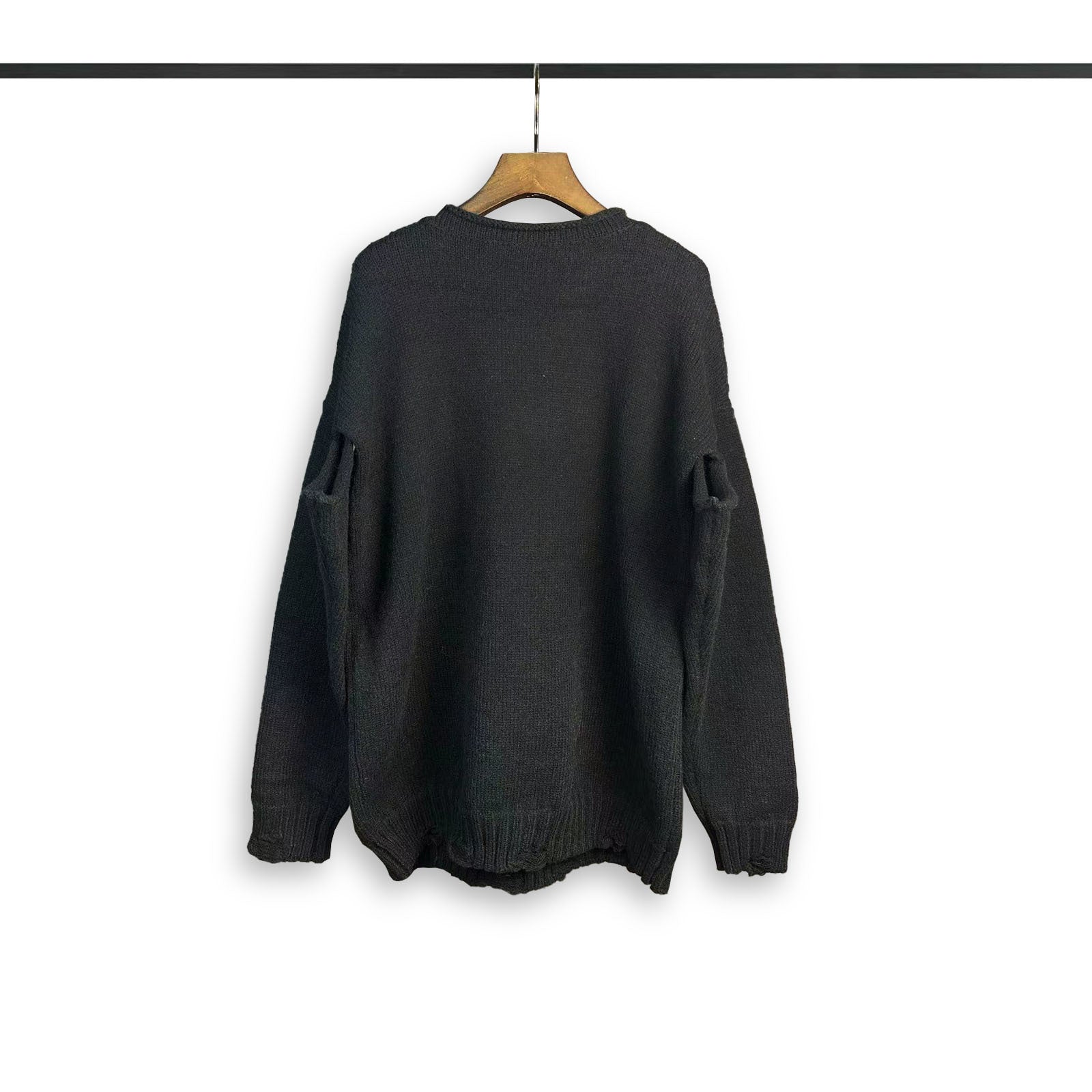 Dark crewneck sweatshirt with long sleeves and ribbed cuffs and hem