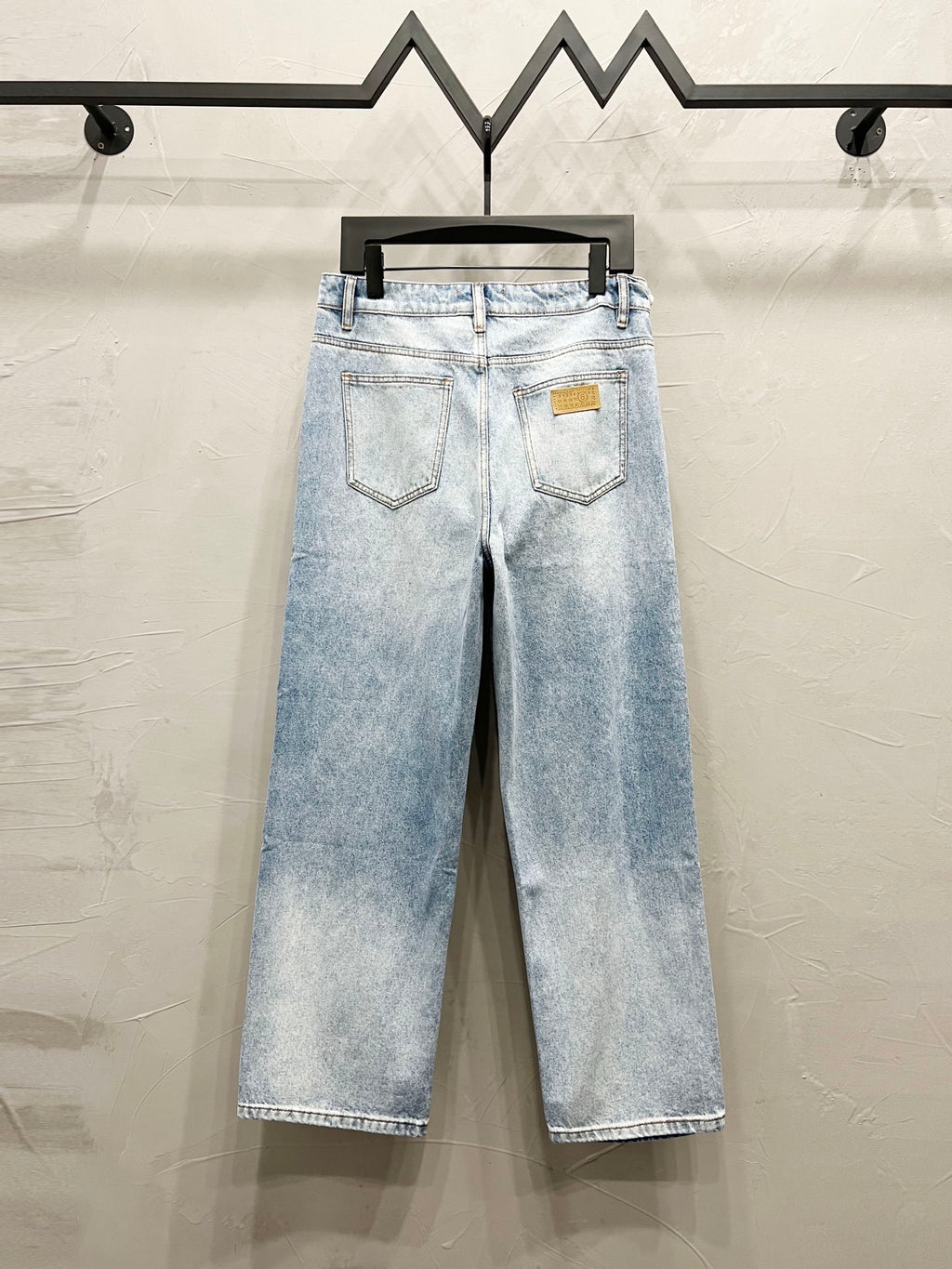 Maison Margiela denim jeans, light wash with back pockets and logo patch on waistband