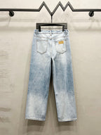 Maison Margiela denim jeans, light wash with back pockets and logo patch on waistband
