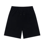 Black shorts with elastic waistband, drawstring, and side pocket