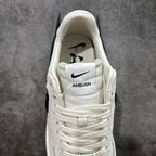 White sneaker heel with Nike logo and stitched AMBUSH label on strap