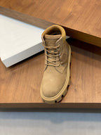 Single tan suede high-top lace-up boot with logo patch near heel
