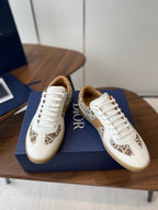 Dior unisex sneakers in white with tan monogram panel and white lace-up design