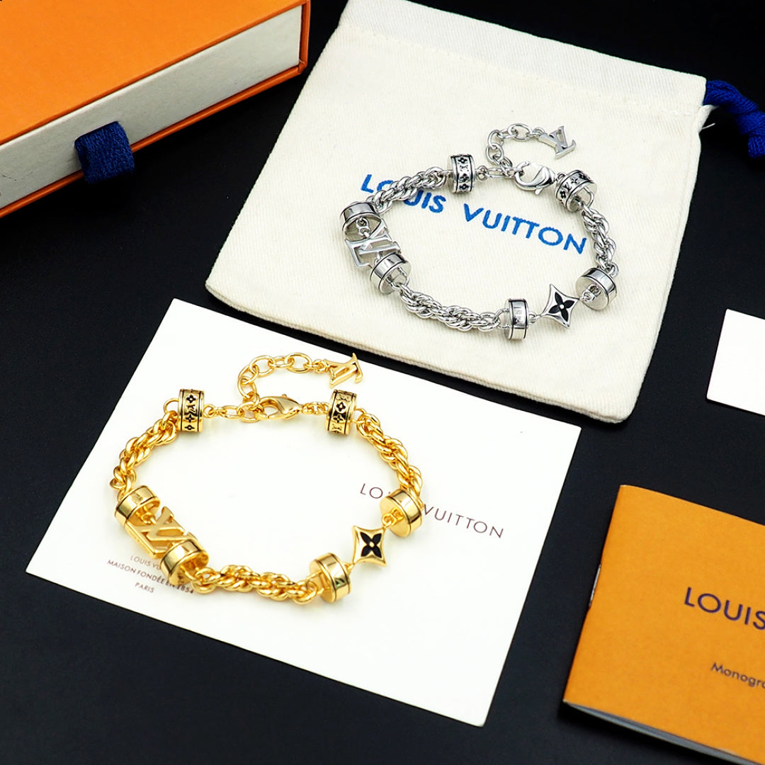 Louis Vuitton charm bracelets, silver and gold linked chain with logo beads and star charms