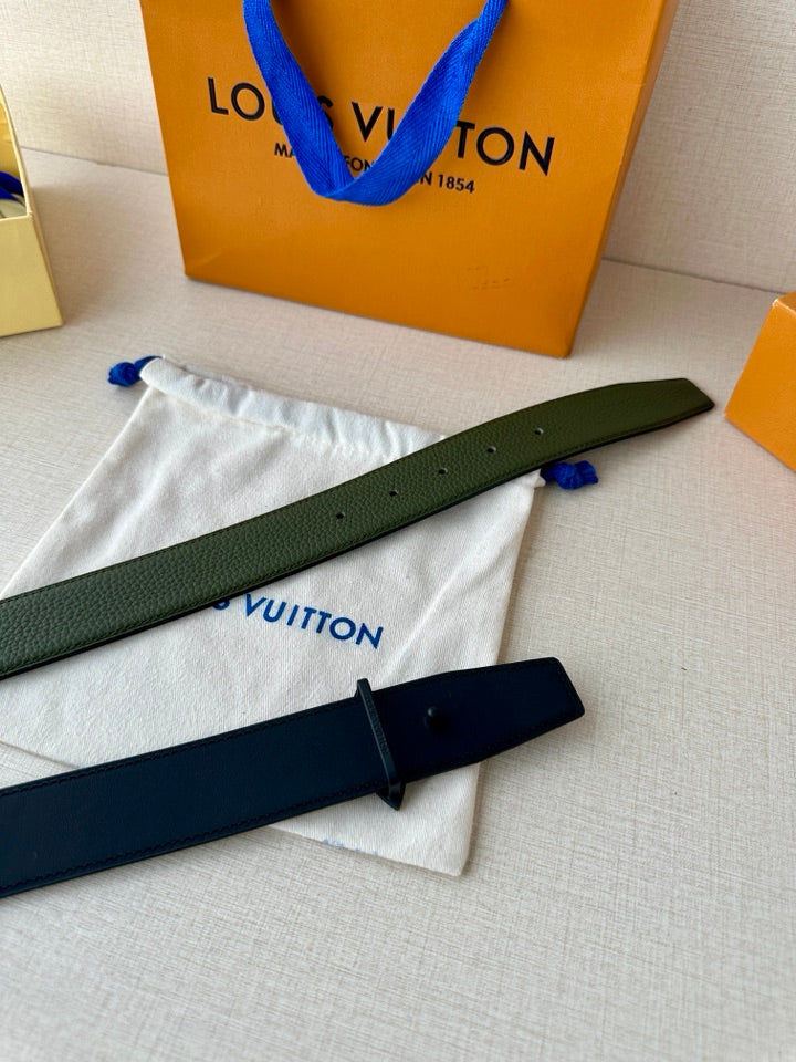 Green and dark blue belts with star buckles on white cloth